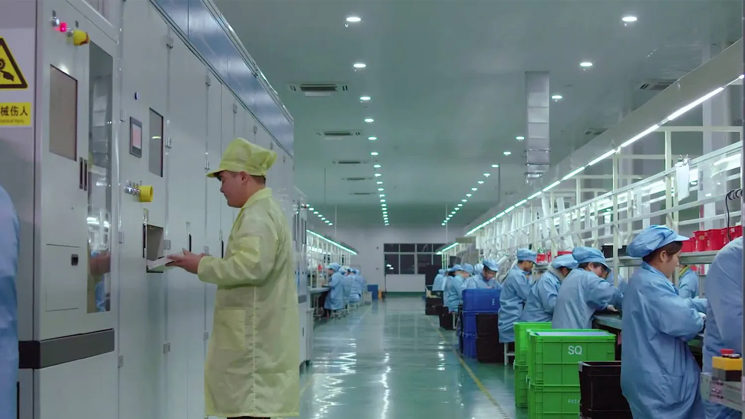 Workers on the production line assembling and testing power hardware